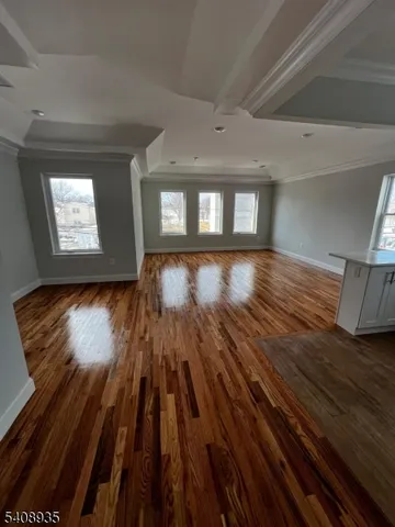 a kitchen with granite countertop a stove top oven sink and cabinets
