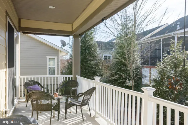 a view of a chair and table in the balcony