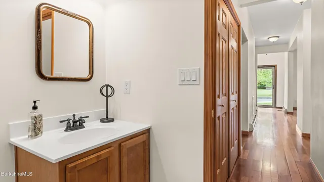 a bathroom with a sink and a mirror