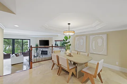 a view of a living room and dining room