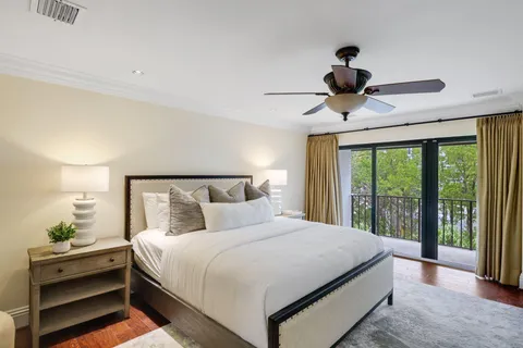 a bathroom with a granite countertop sink a toilet and a shower