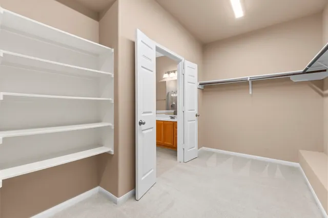 a view of an empty walk in closet