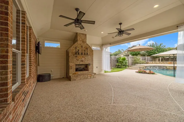 a view of a livingroom with a ceiling fan and window