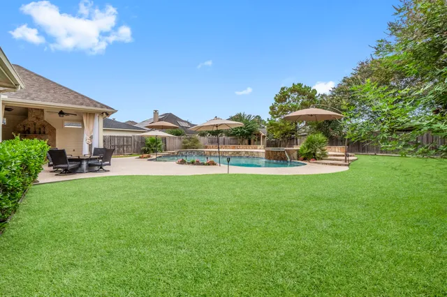 a view of a house with a big yard