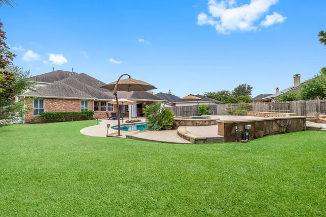 a view of a house with a yard porch and sitting area