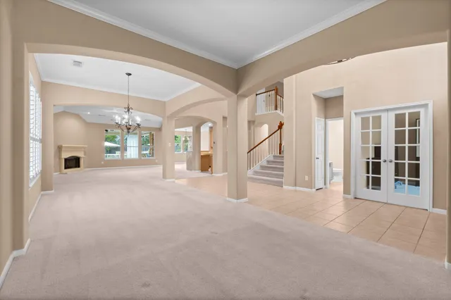 a view of a big room with closet and windows