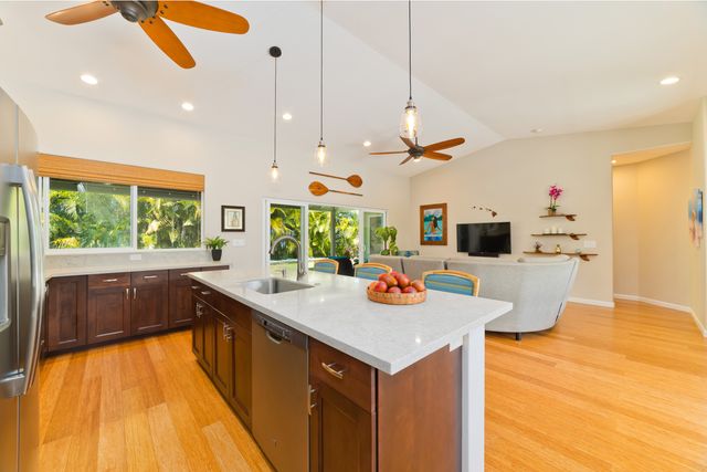 a kitchen with a sink a counter top space and appliances