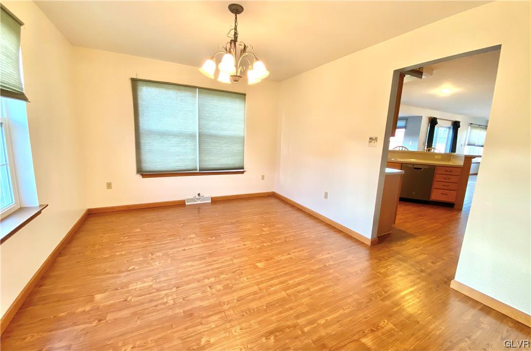 1033 Miller Road Nazareth, PA 18064 - Photo 8 of 23 a view of an empty room with window and wooden floor