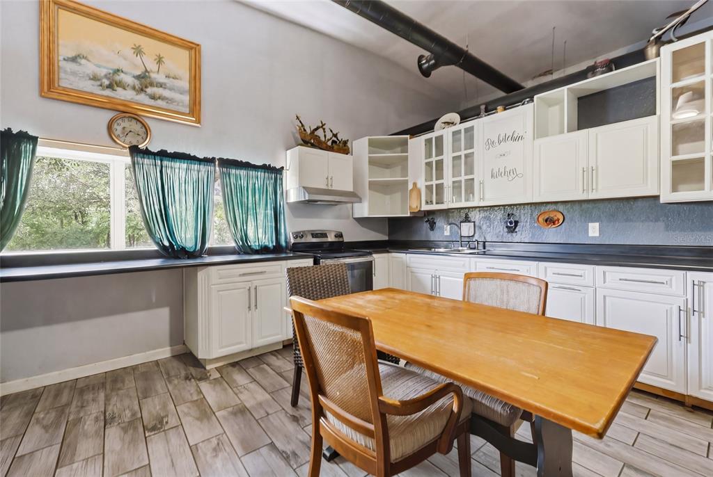 401 Southeast Falcon Road Branford, FL 32008 - Photo 75 of 76 a kitchen with a stove a sink and a refrigerator