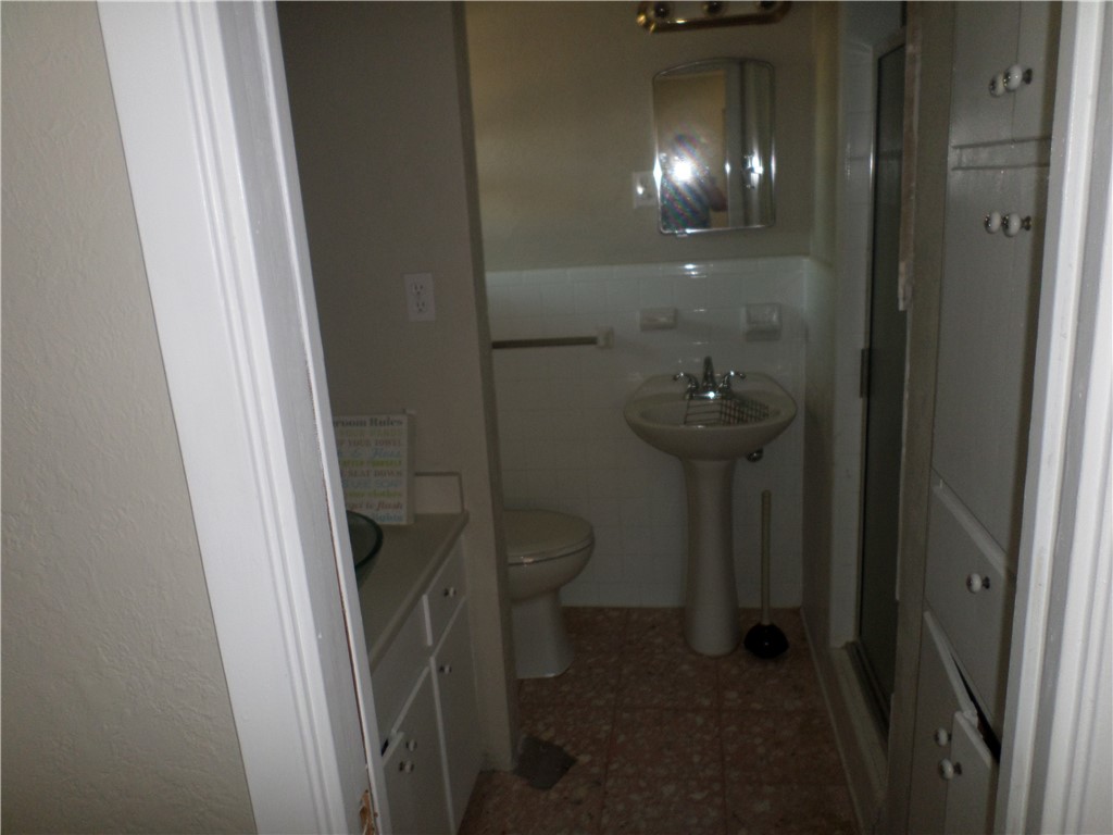 136 Granby Place Portland, TX 78374 - Photo 12 of 16 a bathroom with a sink and toilet