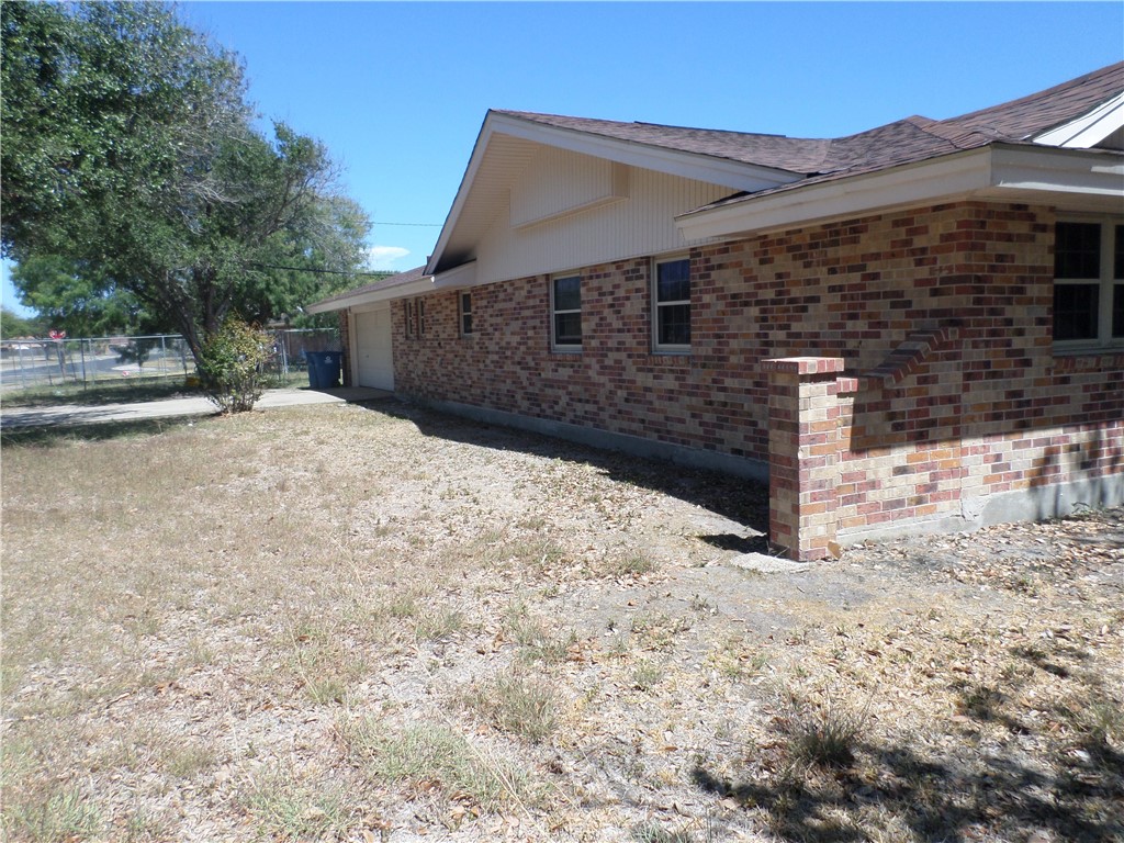 136 Granby Place Portland, TX 78374 - Photo 2 of 16 a front view of a house with a yard