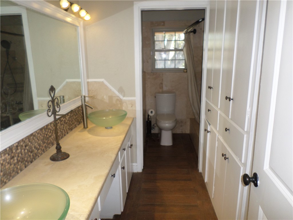 136 Granby Place Portland, TX 78374 - Photo 9 of 16 a bathroom with a sink a toilet and shower