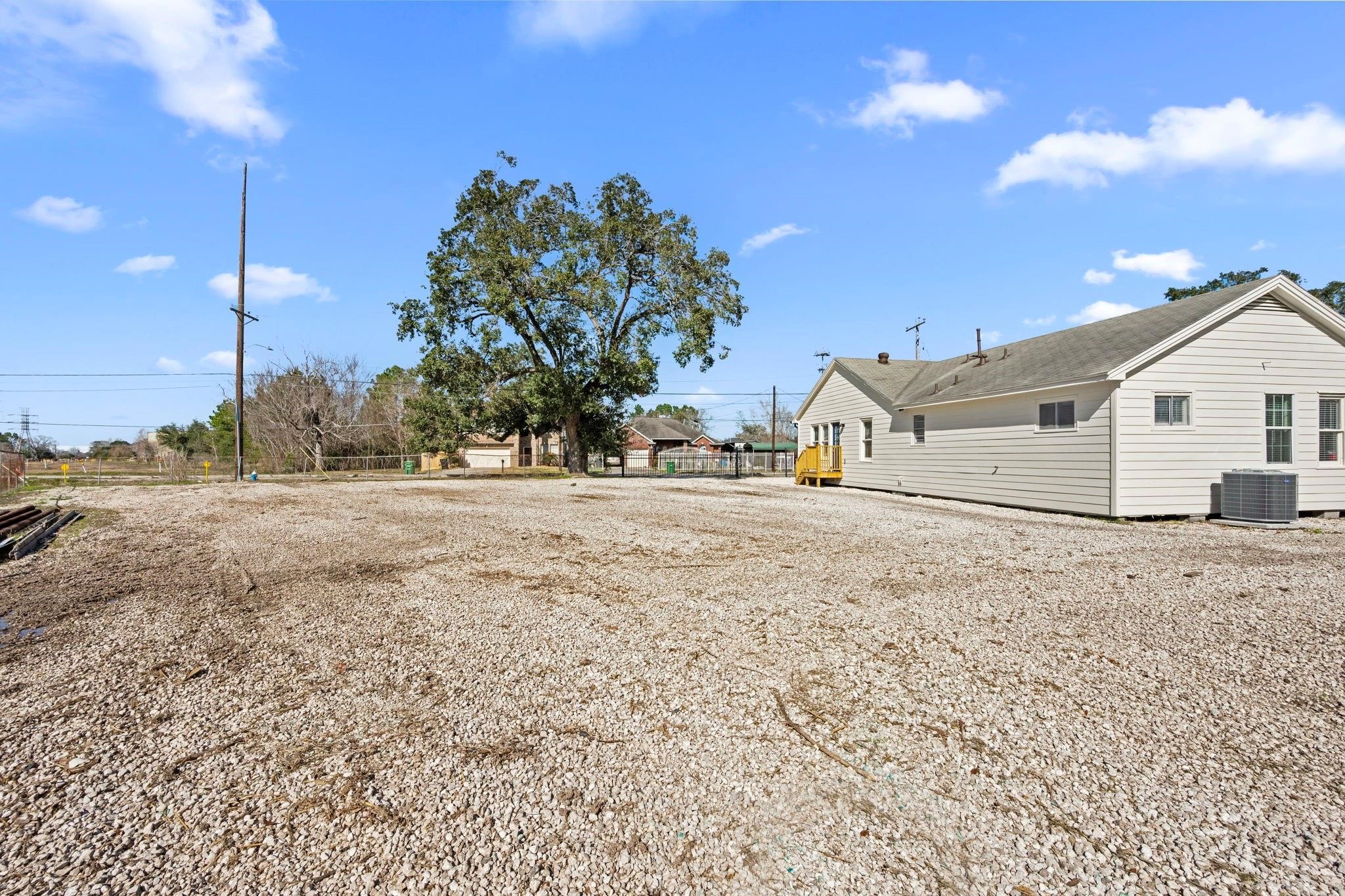 11610 Palmsprings Drive Houston, TX 77034 - Photo 18 of 23 a view of white house with a yard