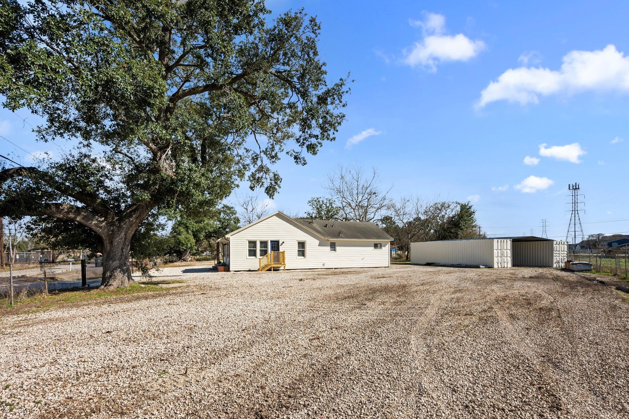 11610 Palmsprings Drive Houston, TX 77034 - Photo 20 of 23 a view of white house with a yard