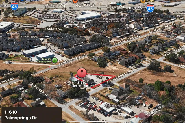 an aerial view of residential houses with outdoor space