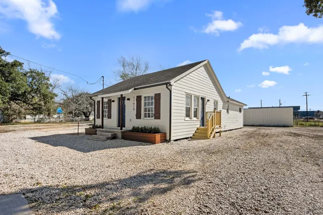 a front view of a house with a patio
