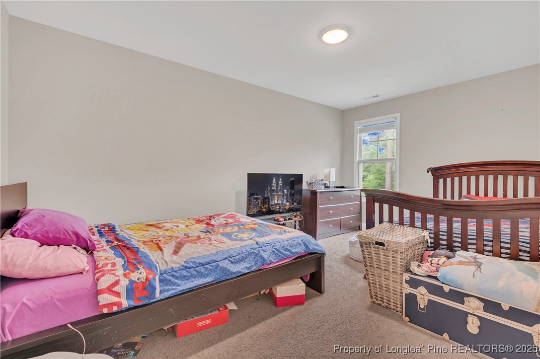 5145 Maxwell Road Stedman, NC 28391 - Photo 21 of 35 a bedroom with furniture and a window