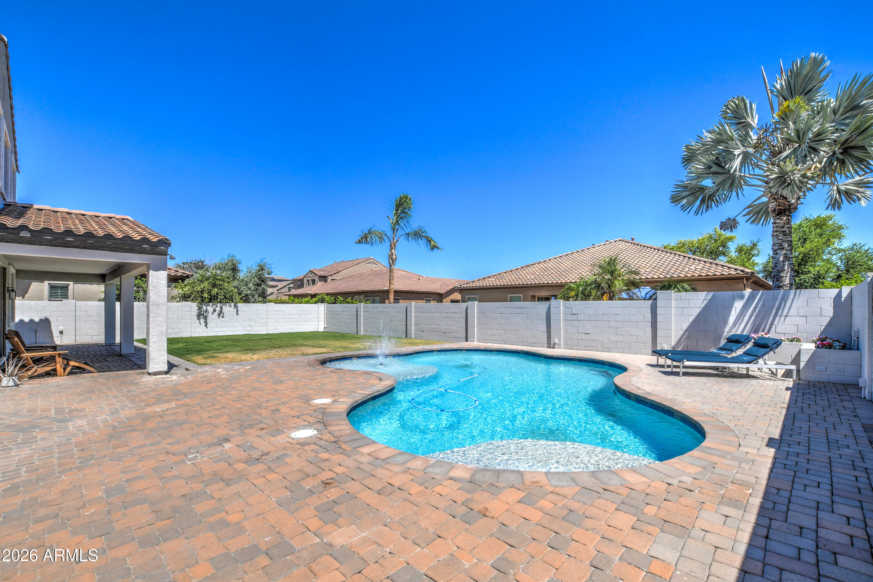 3078 East Muirfield Street Gilbert, AZ 85298 - Photo 84 of 92 a view of a house with swimming pool and sitting area