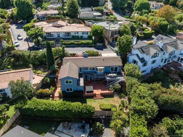 an aerial view of a house with yard swimming pool and outdoor seating