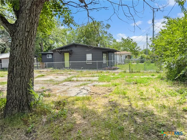 a house with trees in the background