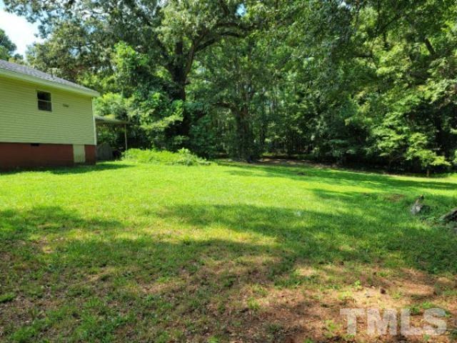 5320 Rock Quarry Road Raleigh, NC 27610 - Photo 6 of 13 a view of a backyard