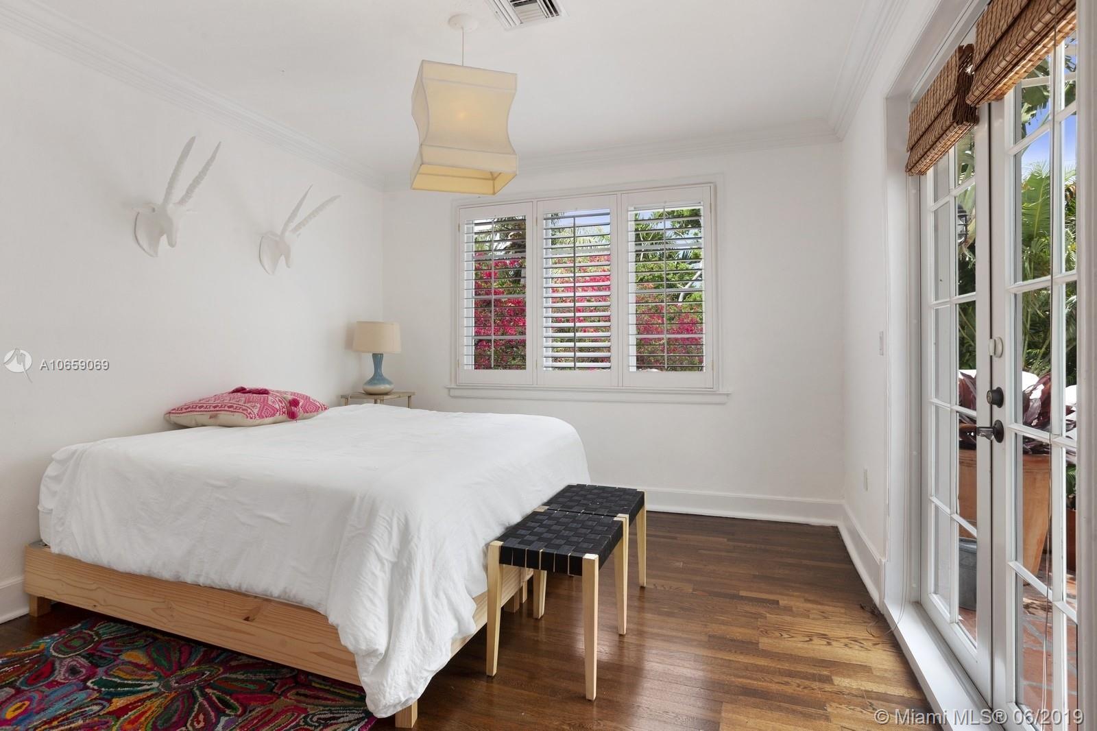 2355 North Bay Road Miami Beach, FL 33140 - Photo 18 of 24 third upstairs bedroom/ french doors leading out onto terrace