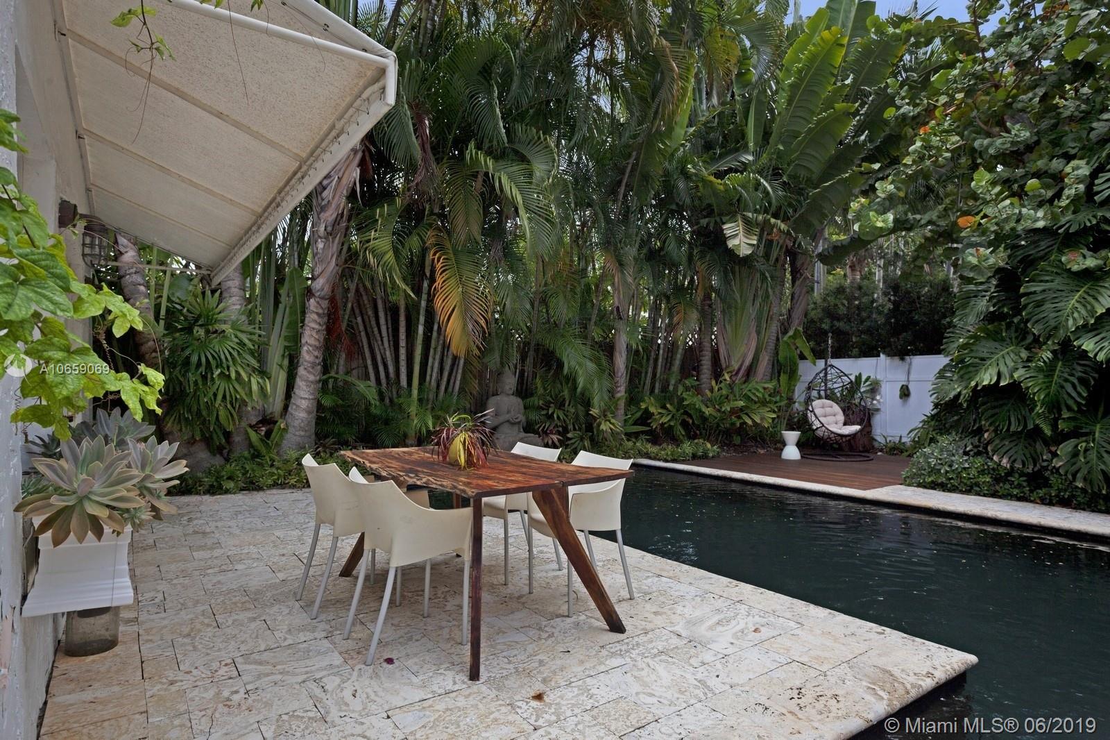 2355 North Bay Road Miami Beach, FL 33140 - Photo 21 of 24 pool area at entrance to guest cabana