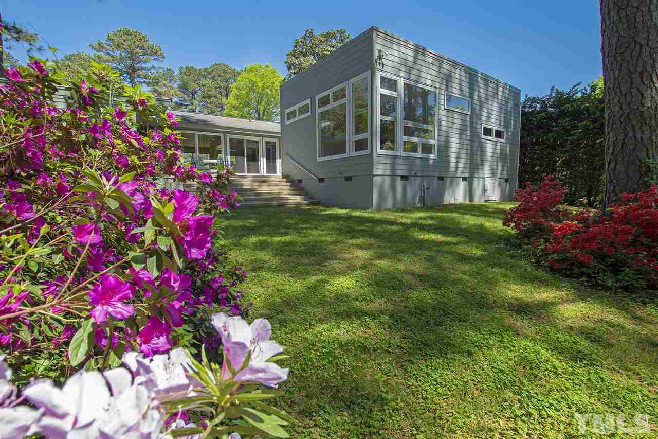 3405 Cherry Lane Raleigh, NC 27607 - Photo 16 of 18 a flower garden is sitting in front of a house
