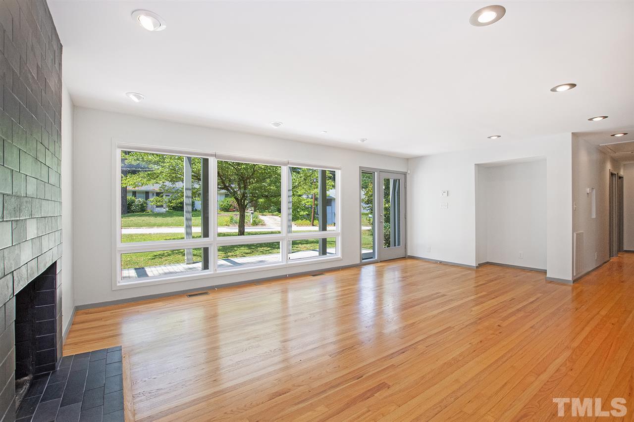 3405 Cherry Lane Raleigh, NC 27607 - Photo 4 of 18 a view of an empty room with wooden floor and a window