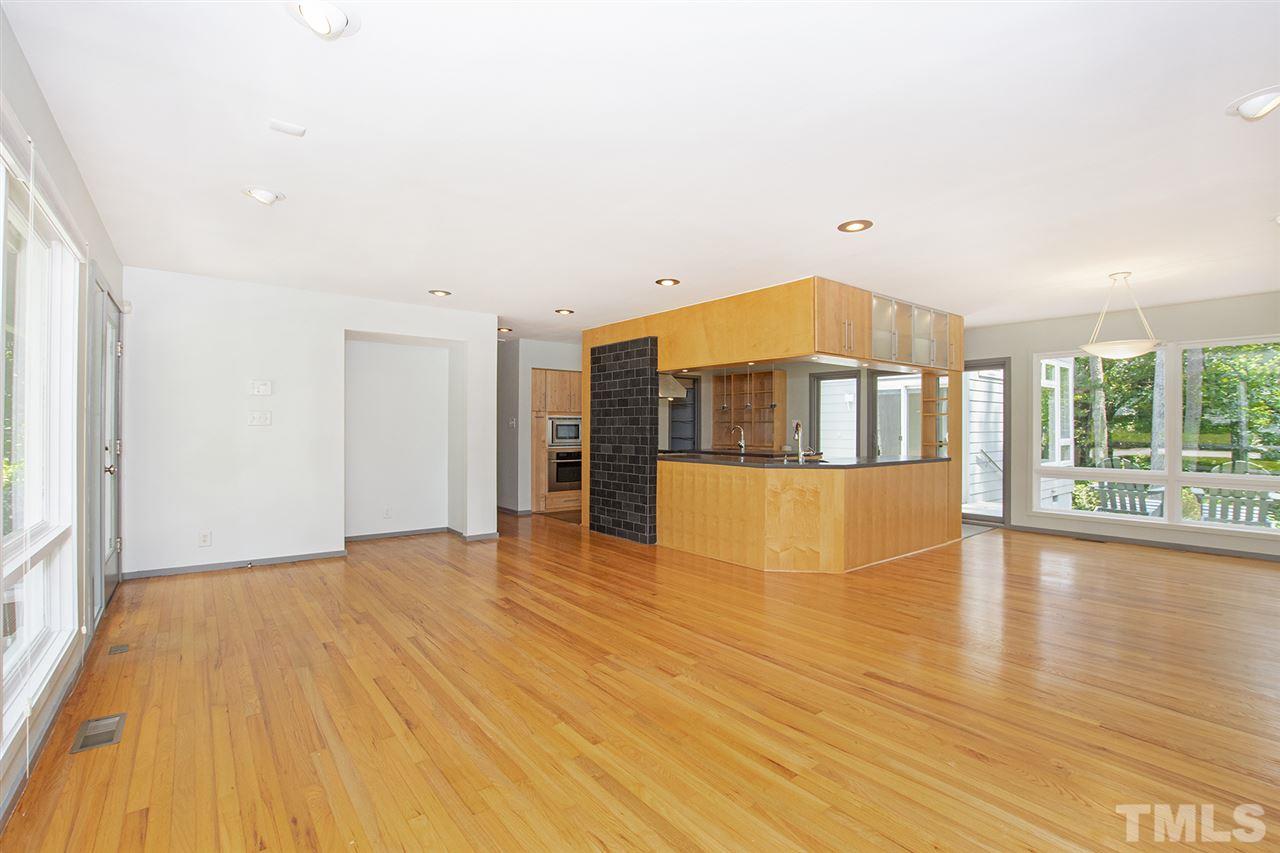 3405 Cherry Lane Raleigh, NC 27607 - Photo 5 of 18 a view of empty room with wooden floor and fan