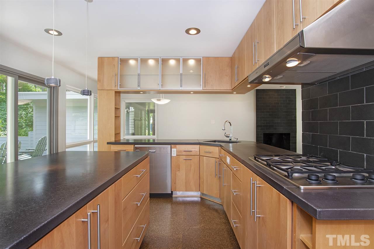 3405 Cherry Lane Raleigh, NC 27607 - Photo 10 of 18 a kitchen with stainless steel appliances a sink dishwasher stove and refrigerator