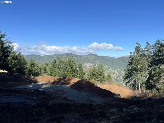 a view of a street with a building in the background
