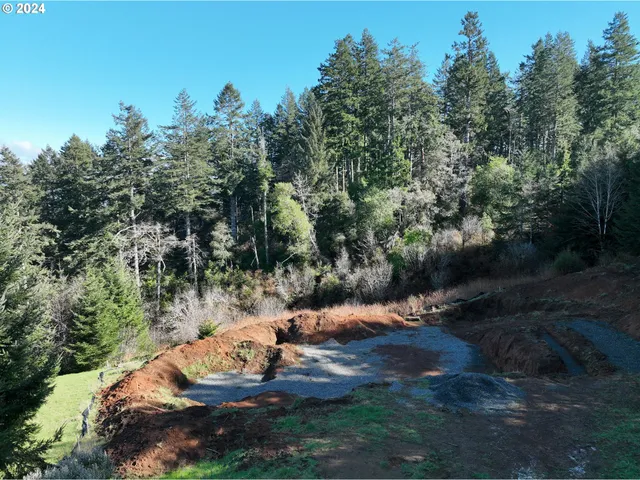 a backyard of a house with a yard and outdoor seating
