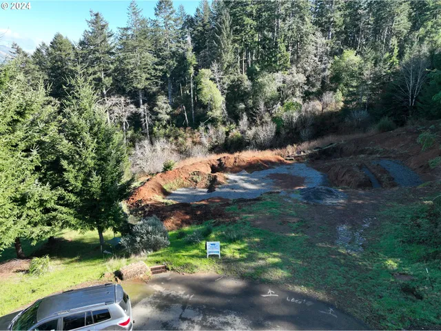 a view of a lake with green space