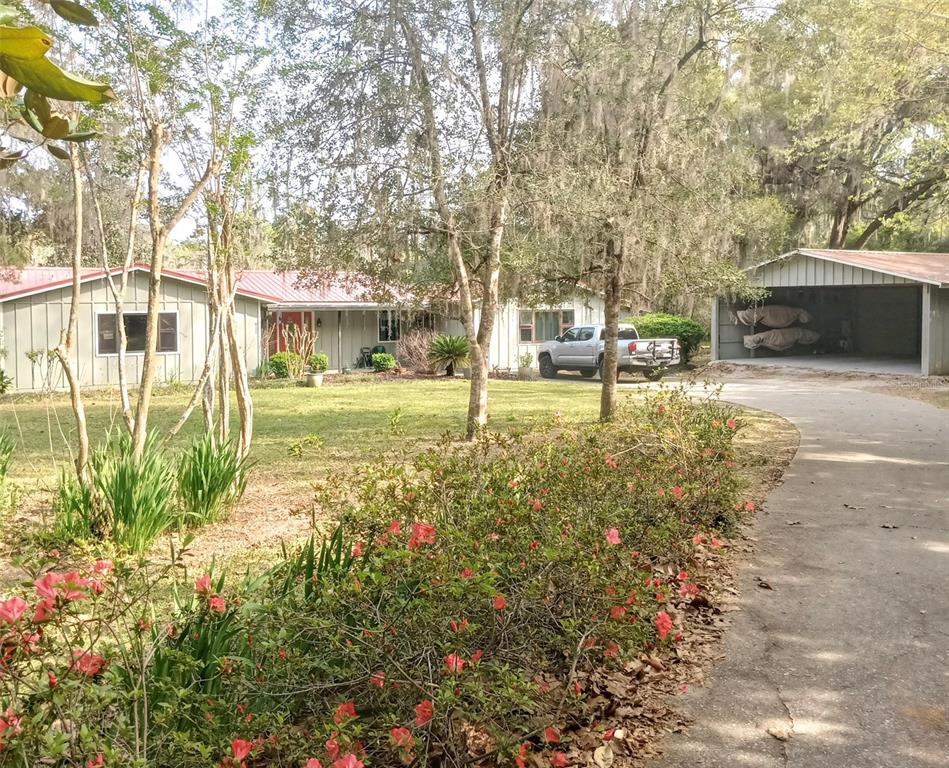 3202 Southeast 29 Lane Gainesville, FL 32641 - Photo 1 of 1 a view of a house with backyard and sitting area