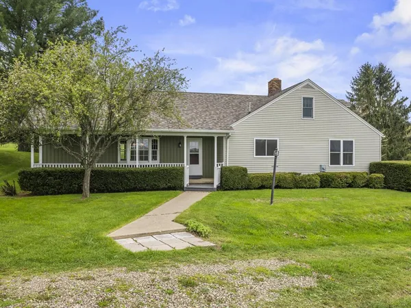 a view of a house with a backyard