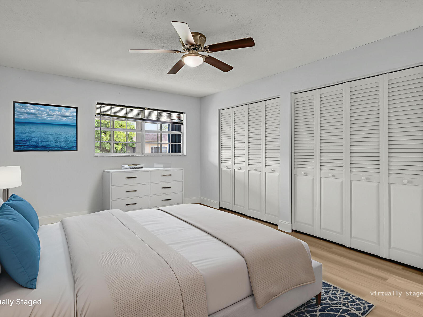 3001 Linton Boulevard, Unit 206C Delray Beach, FL 33445 - Photo 13 of 27 a bedroom with a large bed and a window