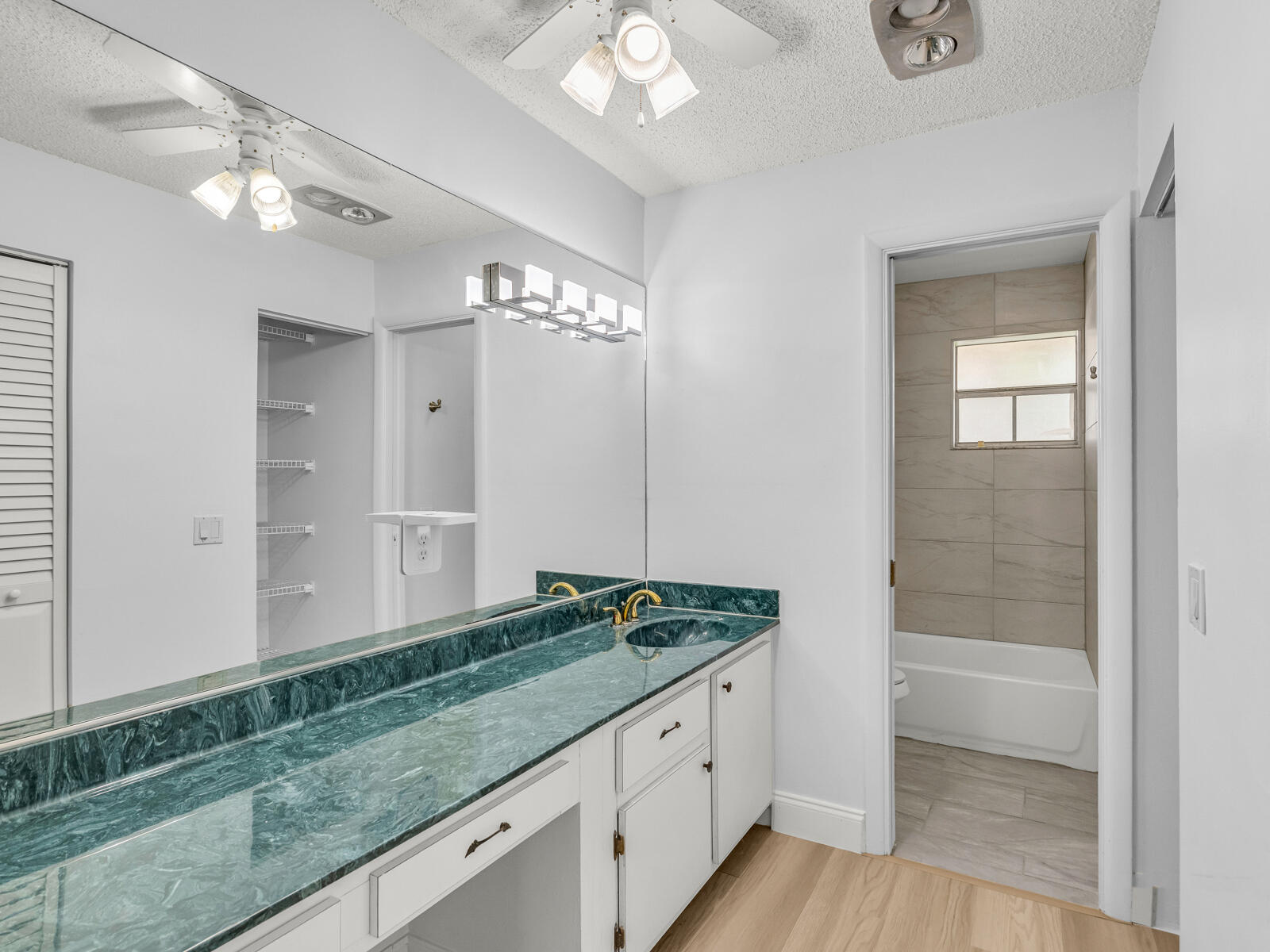 3001 Linton Boulevard, Unit 206C Delray Beach, FL 33445 - Photo 18 of 27 a view of bathroom with dual sinks