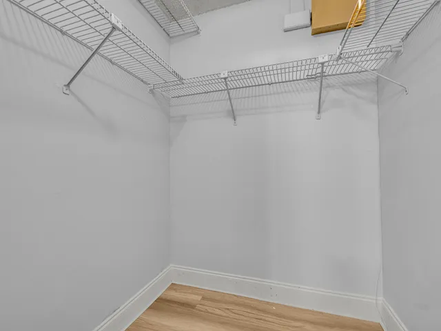 a view of a room with racks on the wall