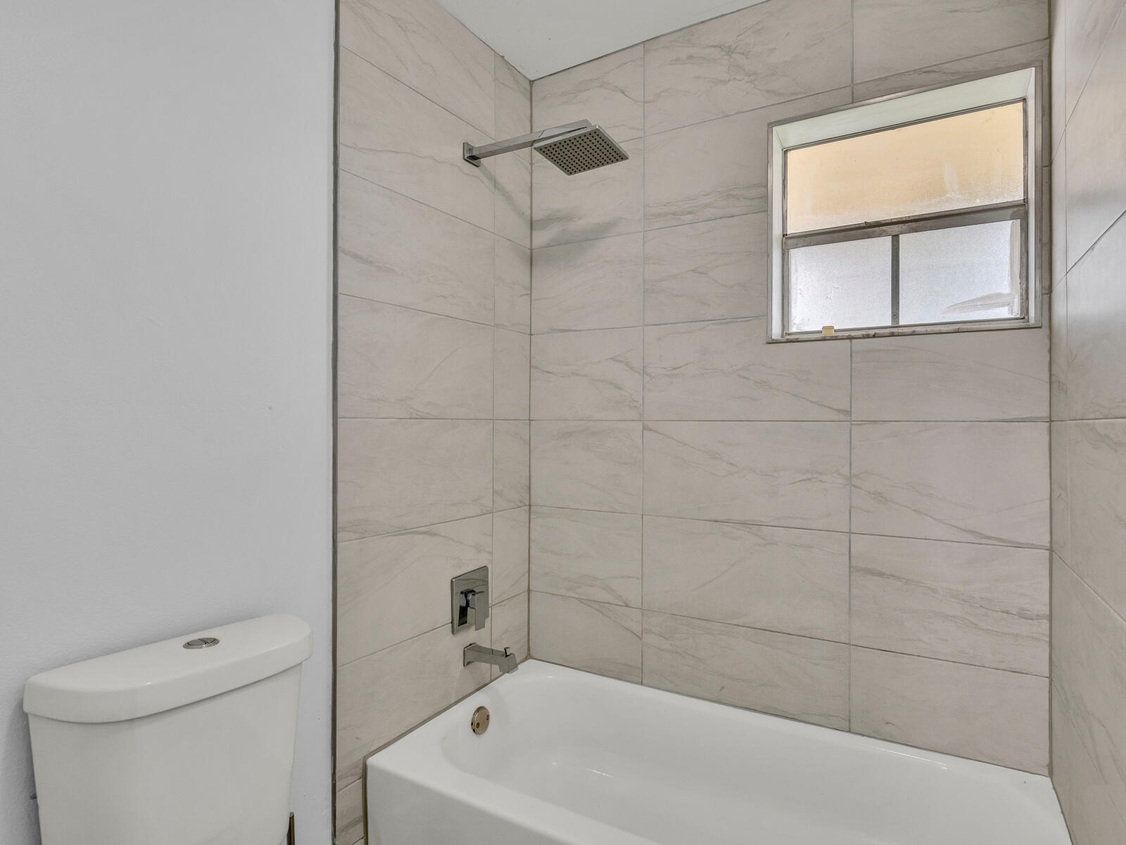 3001 Linton Boulevard, Unit 206C Delray Beach, FL 33445 - Photo 20 of 27 a bathroom with a bath tub a toilet and a shower