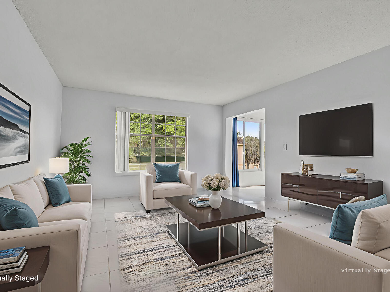 3001 Linton Boulevard, Unit 206C Delray Beach, FL 33445 - Photo 3 of 27 a living room with furniture and a flat screen tv