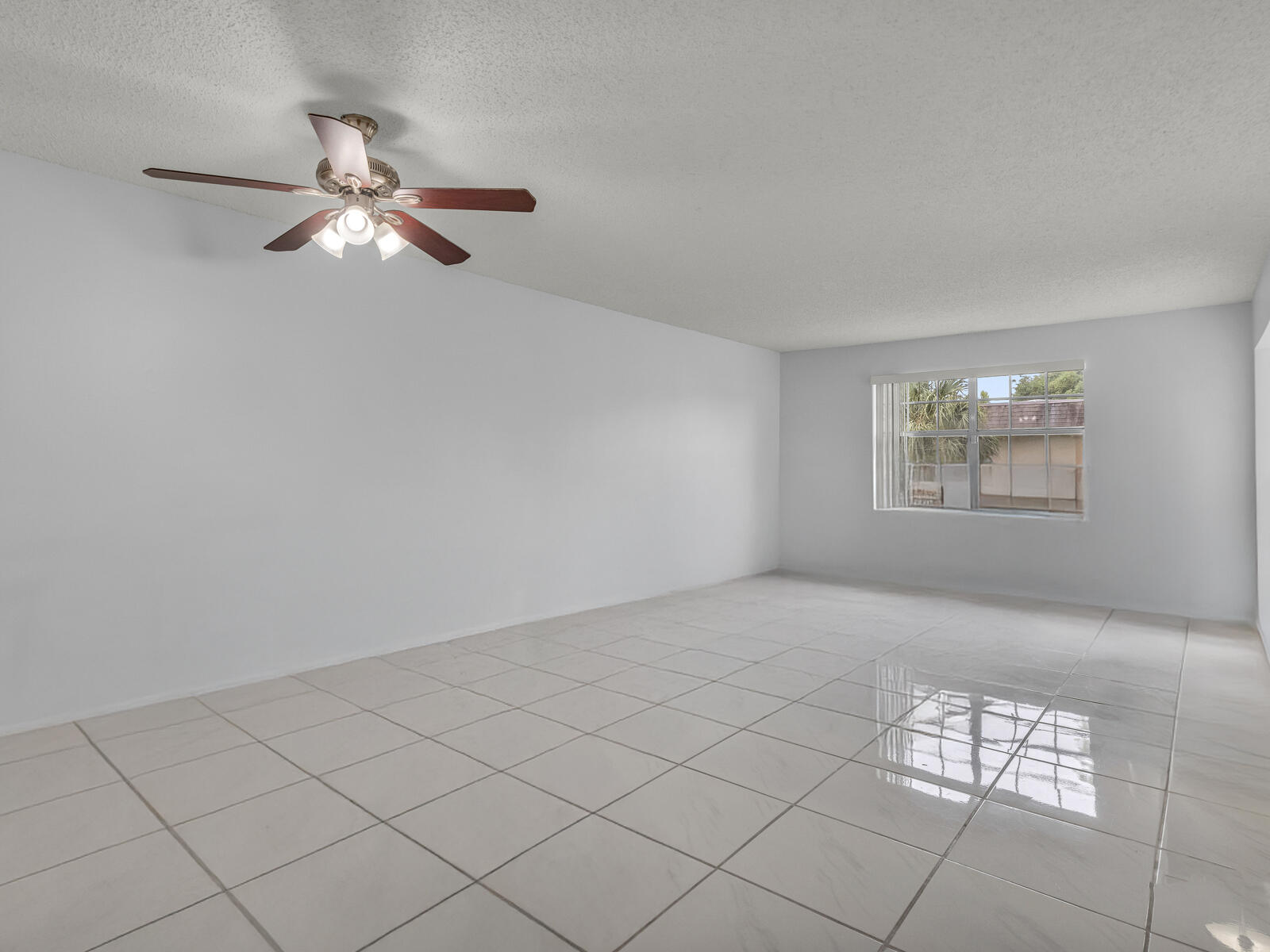 3001 Linton Boulevard, Unit 206C Delray Beach, FL 33445 - Photo 9 of 27 a view of an empty room and window