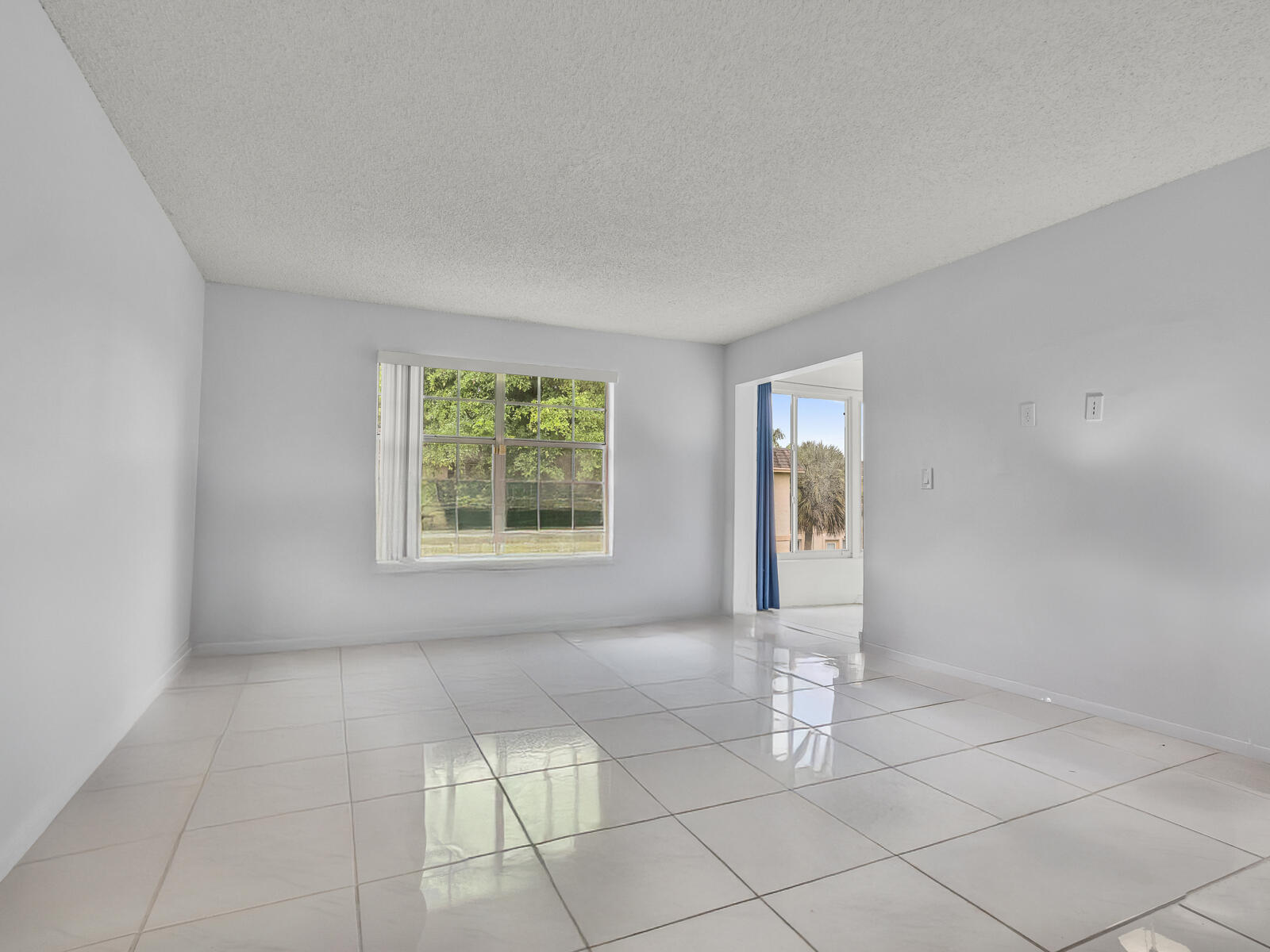 3001 Linton Boulevard, Unit 206C Delray Beach, FL 33445 - Photo 10 of 27 an empty room with windows