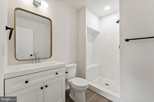 a bathroom with a shower and toilet