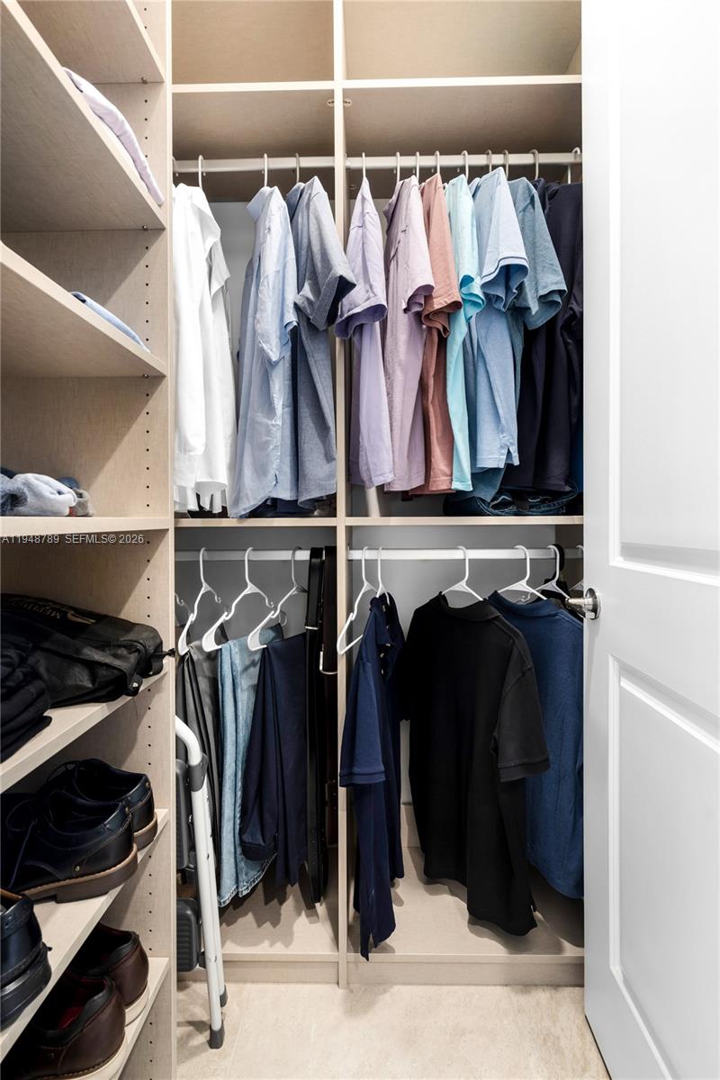 4538 Southwest 173rd Avenue Miramar, FL 33029 - Photo 26 of 48 a view of walk in closet with clothes and shoes