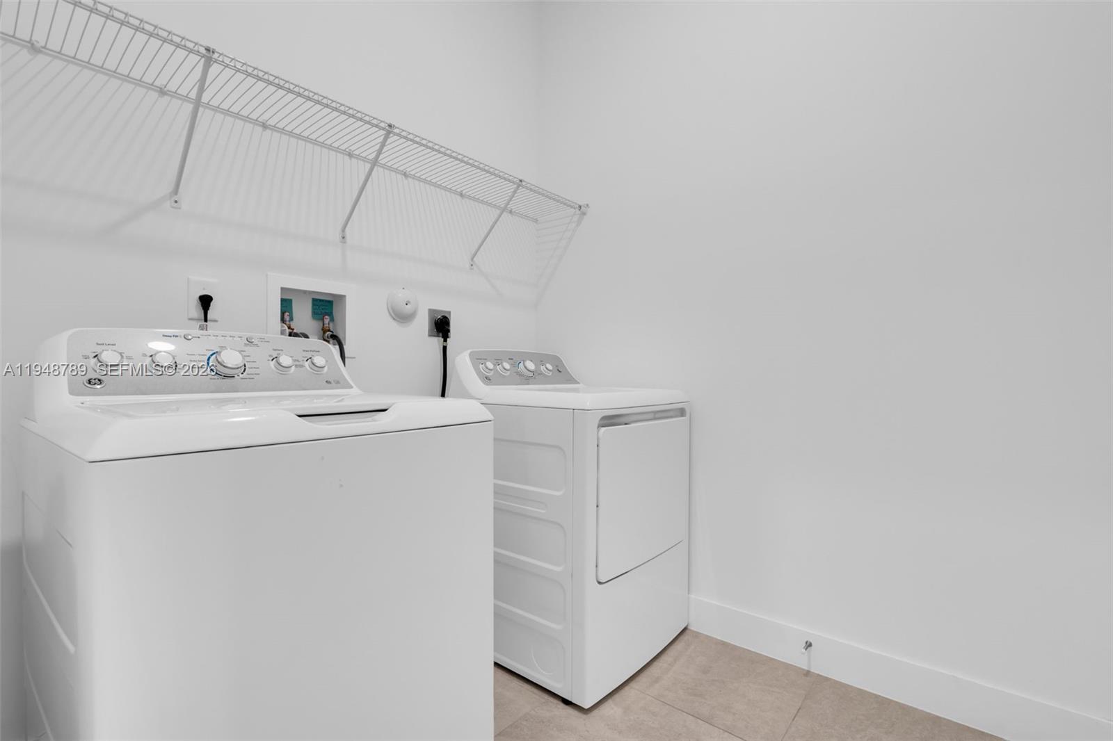 4538 Southwest 173rd Avenue Miramar, FL 33029 - Photo 34 of 48 a utility room with dryer and washer