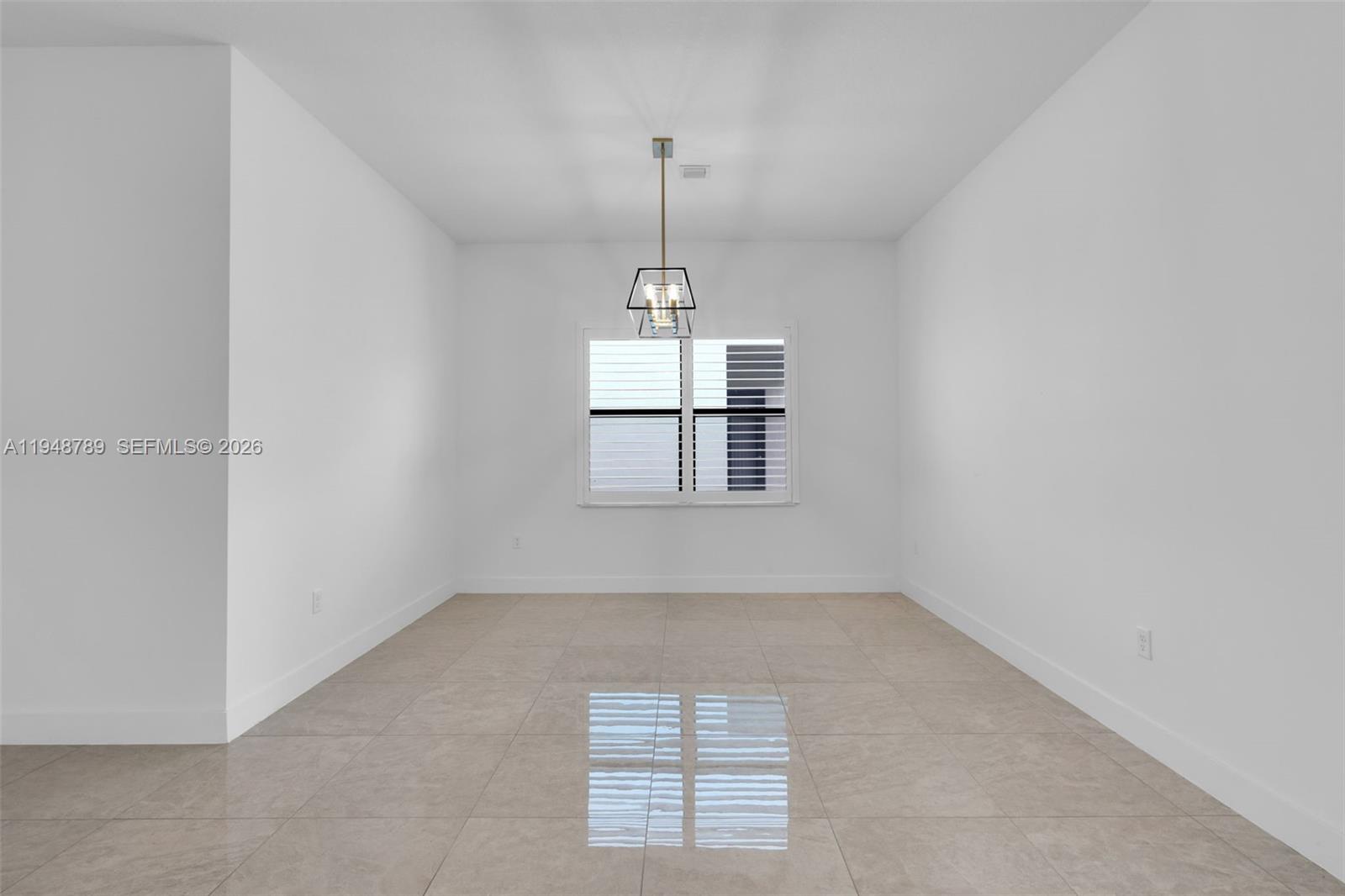 4538 Southwest 173rd Avenue Miramar, FL 33029 - Photo 7 of 48 an empty room with windows and ceiling fan