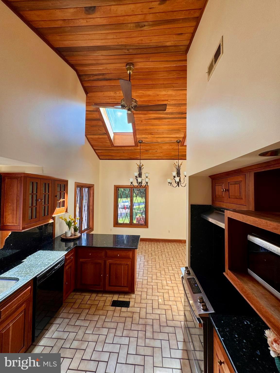 1080 Mt Airy Road Davidsonville, MD 21035 - Photo 18 of 64 a kitchen with granite countertop a stove and cabinets