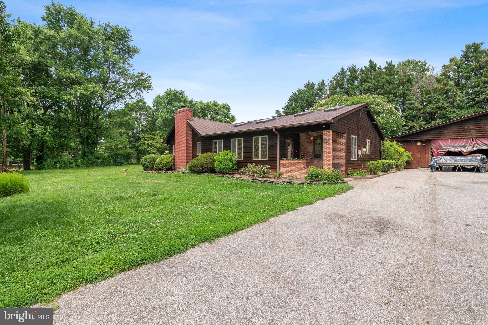 1080 Mt Airy Road Davidsonville, MD 21035 - Photo 7 of 64 a front view of house with yard and green space