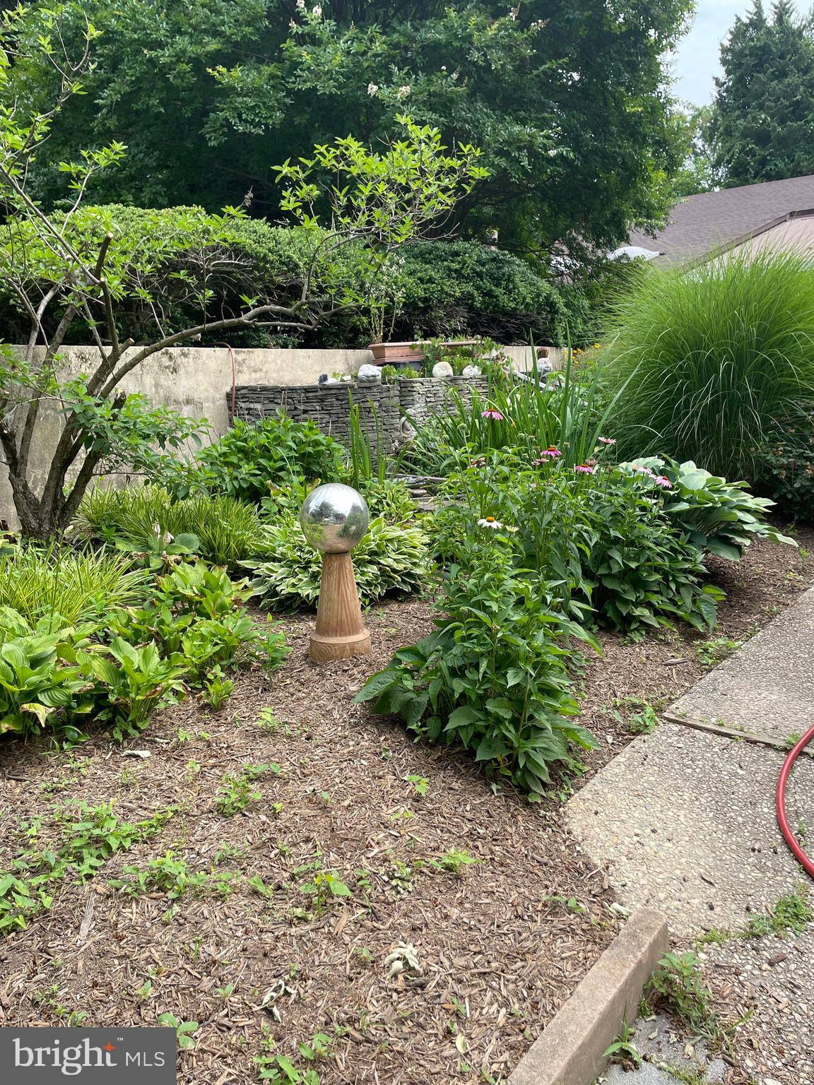 1080 Mt Airy Road Davidsonville, MD 21035 - Photo 9 of 64 a view of a garden with a bench